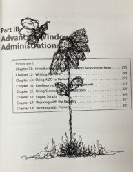 Scribble drawing of a flower and a bee, on a page of a programming textbook